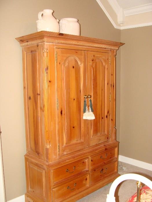 Polished hardwood pine bedroom cabinet with shelving and 4 drawers at the base