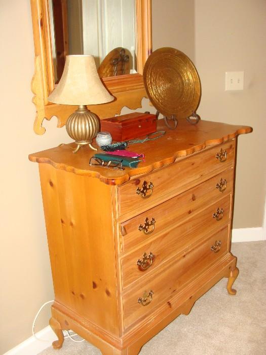 Polished hardwood pine 4 drawer dresser with Queen Anne legs and scalloped edging