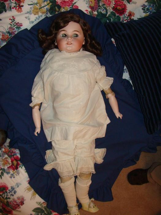 Antique German Doll with leather body and composition lower legs and lower arms from the 1800's