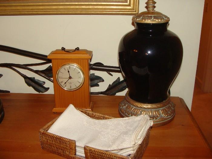 close up of lamp base and clock