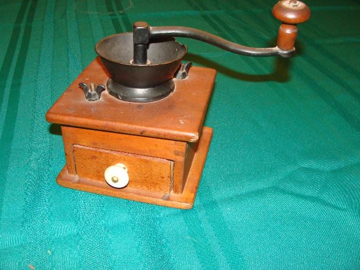 Antique coffee grinder with adjustable grind feature