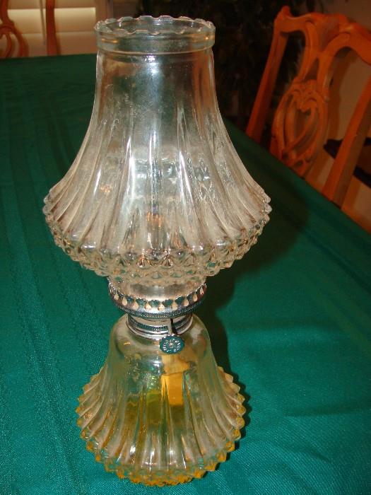 Antique glass oil lamp very unusual in that the glass shade and base have a matching design
