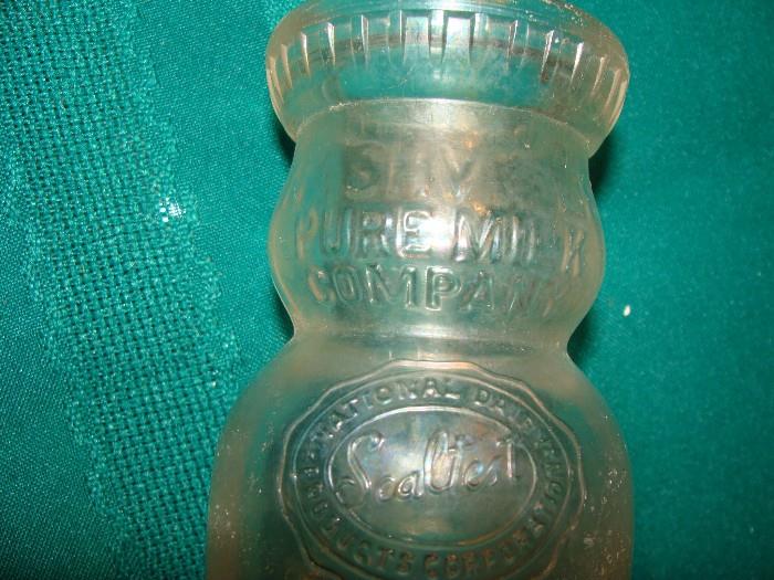 Antique Milk Bottle signed Nashville Pure Milk Company with the Sealtest emblem embossed in the glass. This bottle has been well preserved