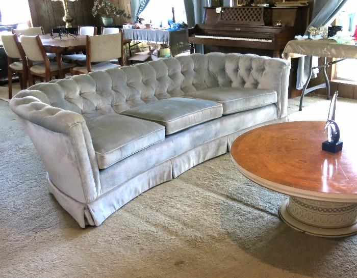 Vintage curved blue velvet curved Chesterfield mid century sofa--excellent condition.  Amazing round coffee table with detailed base and inlaid veneer top.