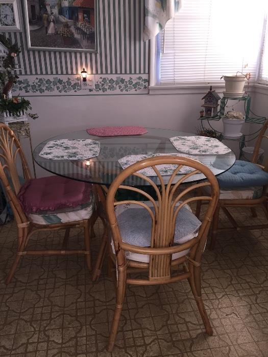 Rattan glass top table and 4 chairs