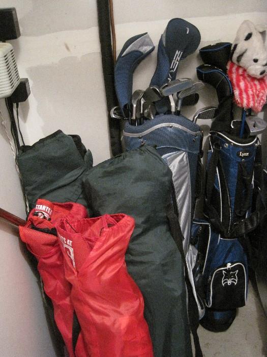 Sets of golf clubs.