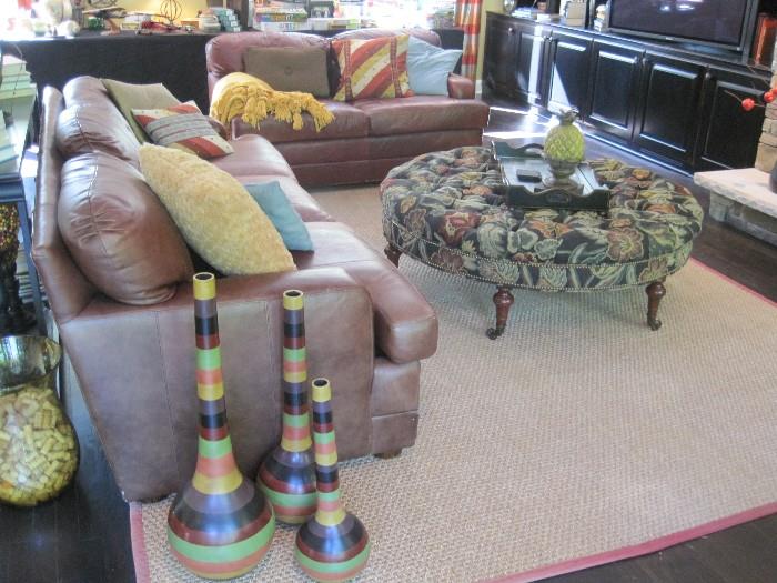 Henredon leather Sofa and matching love seat. Round button back ottoman/coffee tables. Jute area rug. Decor items.