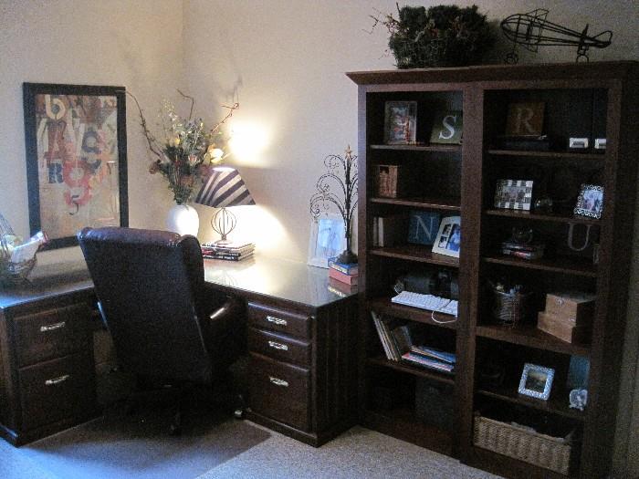 Corner desk.  Executive armchair. Bookcases.
