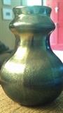 This vase is 3 and 3/4 tall. It is marked L.C. Tiffany-Favrile  5370G. Incandescent silvery blue green.Great shape.
