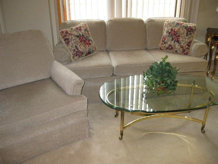 Very nice, clean sofa and chair, glass top coffee table
