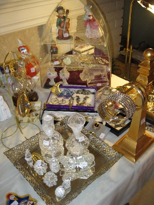 assorted perfumes, jewelry and figurines