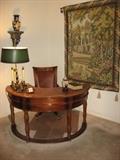 semi circular desk with leather top and nail head trim and matching desk chair