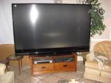 63" across, 73" on the diagonal Mitsubishi rear projection TV - replacement bulbs available too
