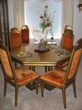 the dining room table includes six chairs, two leaves and felt pads