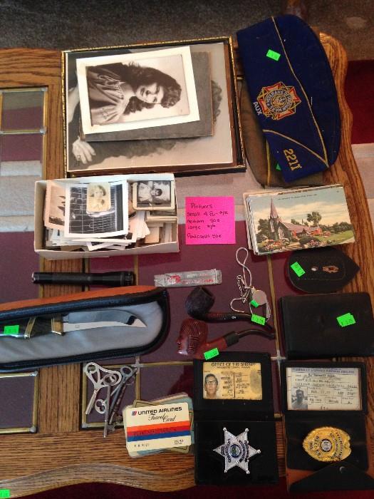 black and white photos, police and arms dealer badge, keys, knife, pipes, postcards (more of these items to be pictured soon!)