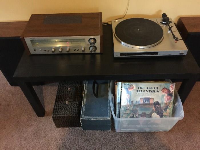 Fisher High Fidelity Turn Table, Assorted Records Technics AM/FM Receiver, Panasonic Speakers, Eight Track Tapes