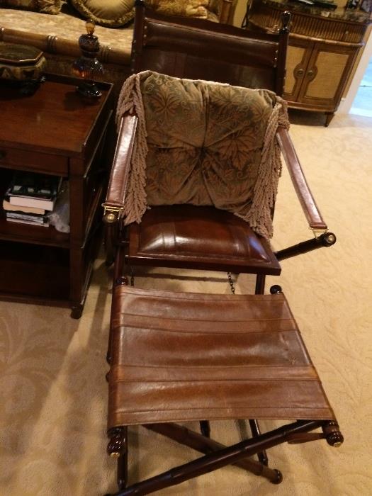 two leather chairs with ottoman