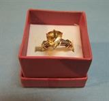 5+ Carat Natural Yellow Sapphire flanked by Tapered White Sapphires in a 18kt Marked Gold Mount. This ring is signed "Van Cleff & Arpels", but has not been authenticated (from Estate)