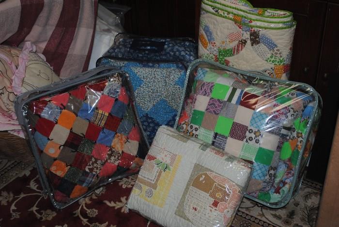 Patchwork quilts. Some with matching pillow or curtains