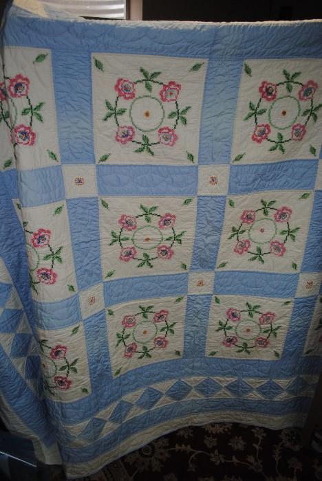 Embroidered, hand quilted quilt