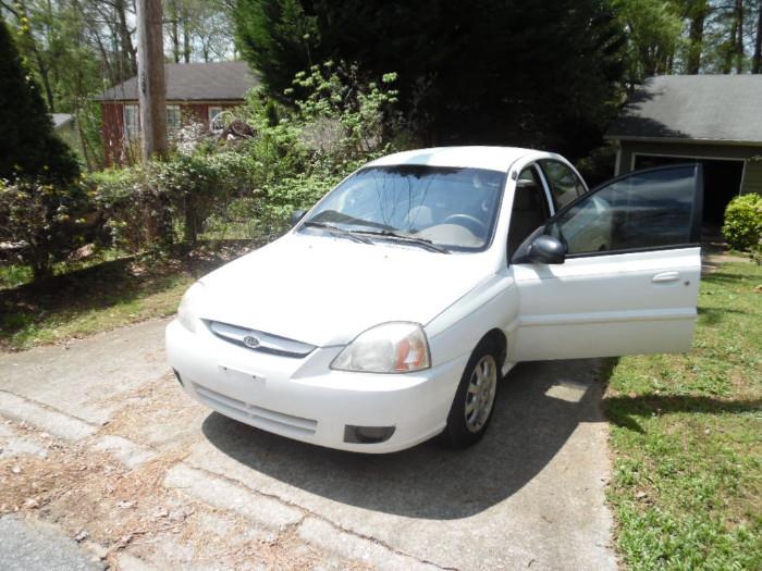 Pre-sale item this car is excellent condition. contact me for price, blows cold AC one small body damage on the passenger side. 2002 kia Rio 66000 miles. Garage kept and non smoker owner.