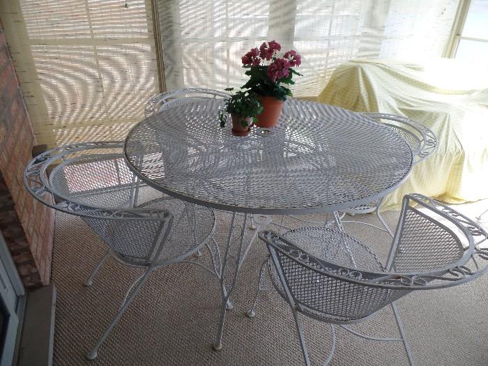 Wrought iron round table with 4 chairs, umbrella and stand