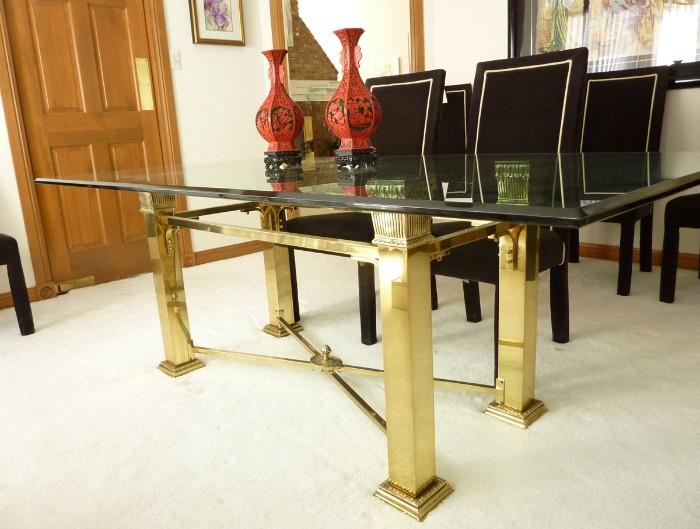 Handsome brass dining table and 8 dark chocolate brown dining chairs