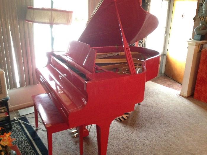Kawai Baby Grand piano made 1976 in Japan.  Measures 5'10 1/2"...1 of 5 made in this red/orange lacquer color.  With matching bench