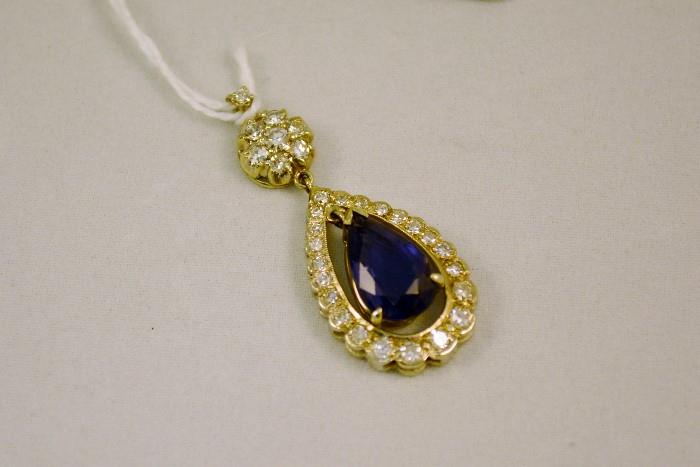 This Pendant was given as a 35th Wedding Anniversary Gift and is the one featured in the Painting of Ms. G in the French Bedroom.  It is Custom Made w/Diamonds and a Teardrop Sapphire. 