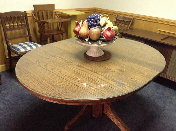 Round oak table with pedestal base