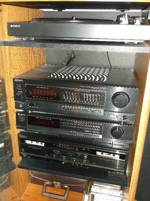 Sony turntable, amplifier, cassette tape & CD player, and speakers in cabinet