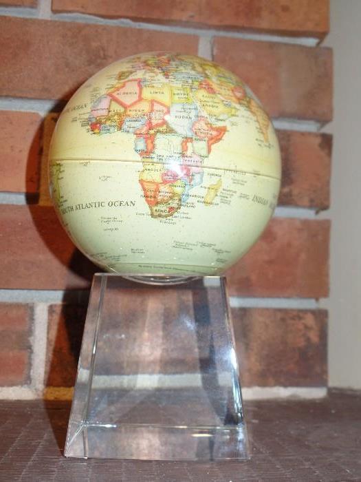 Powered by the Sun-Mova rotating globe on acrylic  stand