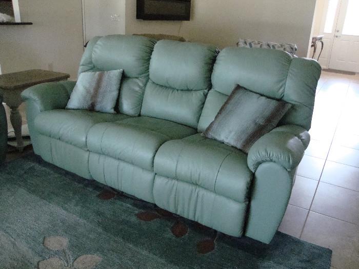 Electric, reclining ends, leather sofa, center folds down