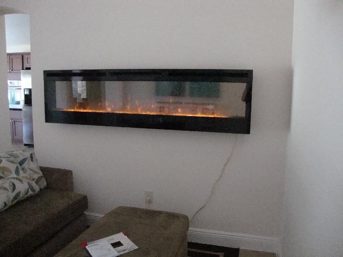 Stunning, Dimplex wall mounted fireplace, remote controlled, 74" long