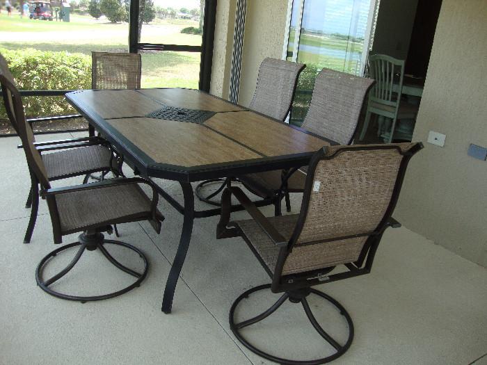 Lanai dining set, 4 rocker swivel chairs, 2 side chairs, stone inlay top