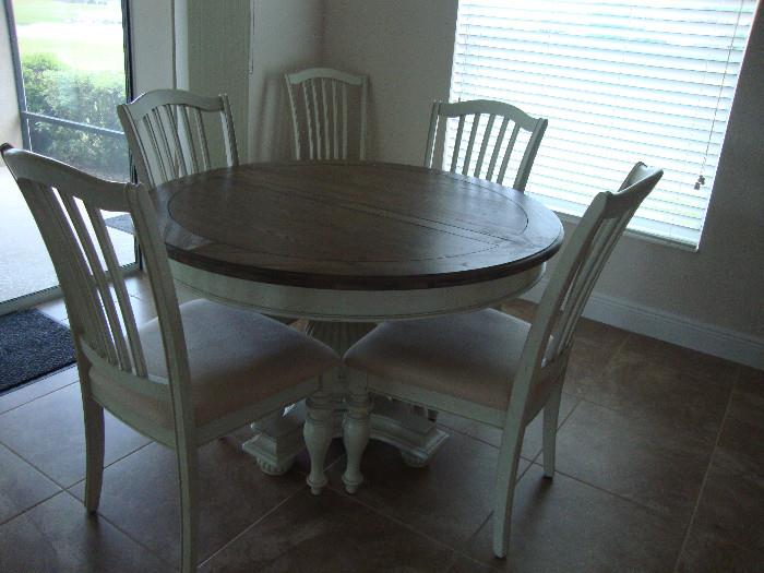 Dining table, 1 leaf, 6 chairs. White wood pedestal base, Driftwood color wood top
