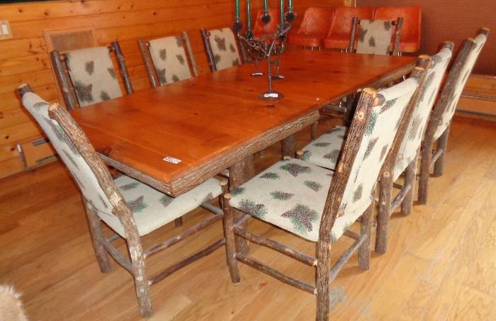 Custom made barkwood dining room table with 2 leafs and 8 matching chairs. 