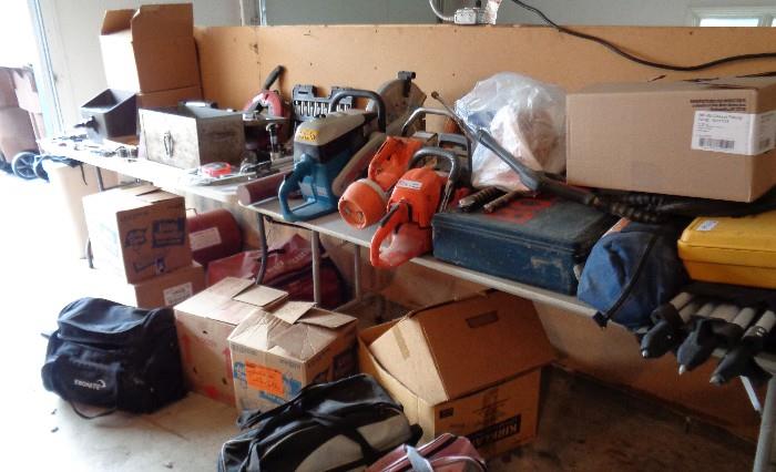 Lots of "Man Cave" stuff: air compressor & tanks, chain saw, wet/dry saws, generator, focus industrial lights, Misc. hand tools & much more.