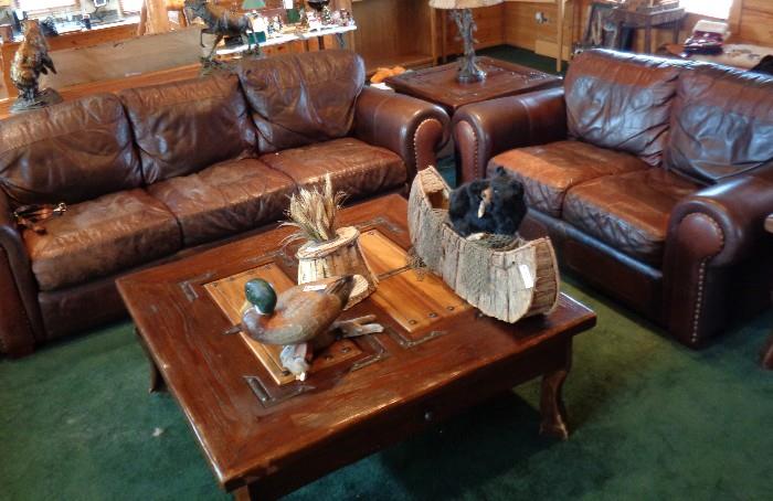 Legacy two-tone brown leather couch & Love Seat. Beautiful heavy wood & iron accented coffee & end tables.