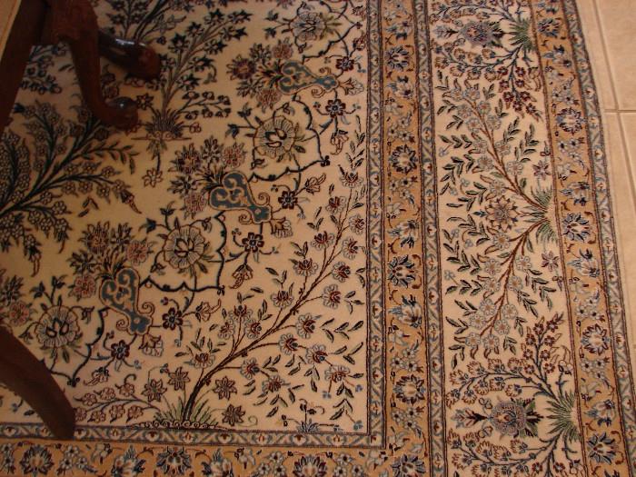 Beautiful silk rug. Natural ground with sky blue and brown design.