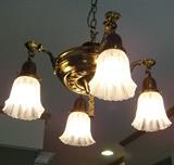One of three light fixtures from the first quarter of the 20th century that will be for sale.