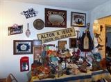 Manly man table with beer signs, toys, car horn, vintage gas pump nozzle, etc.