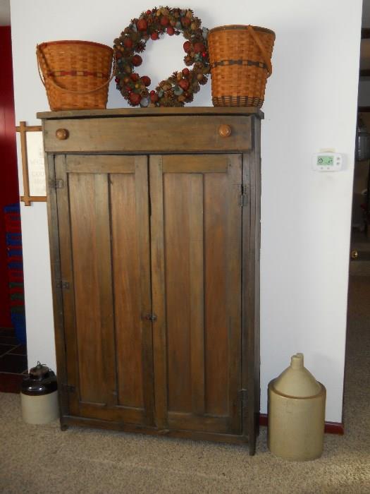 vintage pine vertical cupboard, Longaberger baskets, jugs, etc.