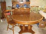 Ethan Allen nutmeg round table, 2 leafs, 6 chairs.