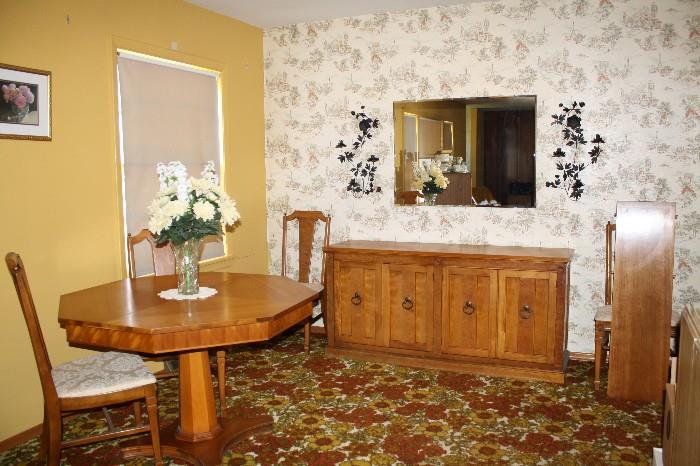 8 piece Dining Room Set - octagon table with 4 chairs and 2 leafs and a buffet cabinet.
