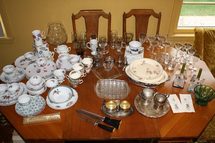 Stem ware, glass ware, carving set, china cup and plate sets.