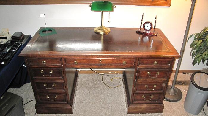 Sligh of Grand Rapids, oak with leather top.