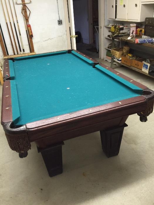 AMC POOL TABLE WITH BALLS AND CUE STICKS. 