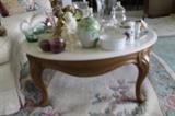 Round marble-topped coffee table.
