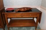 Sideboard whose side leaves can be raised, and which has a roomy shelf below.